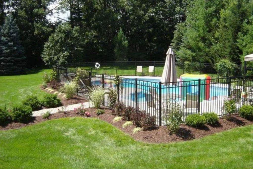Beautify Pool Fence with Floral Surroundings and Mulch Beds