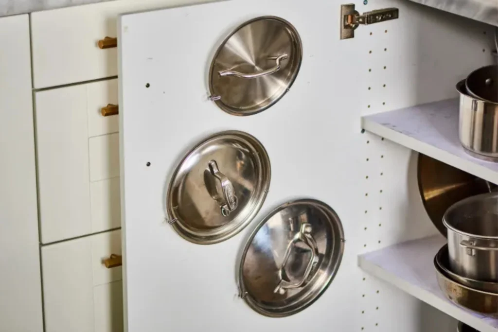 Use Command hooks to hang pot lids on cabinet doors