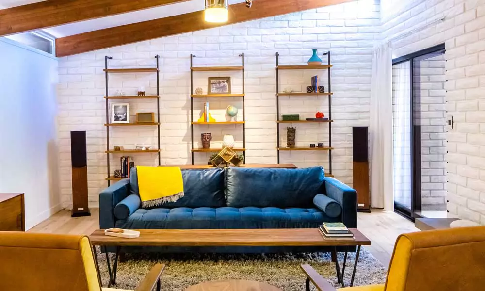 Use Geometric Prints to Complement a Blue Sofa